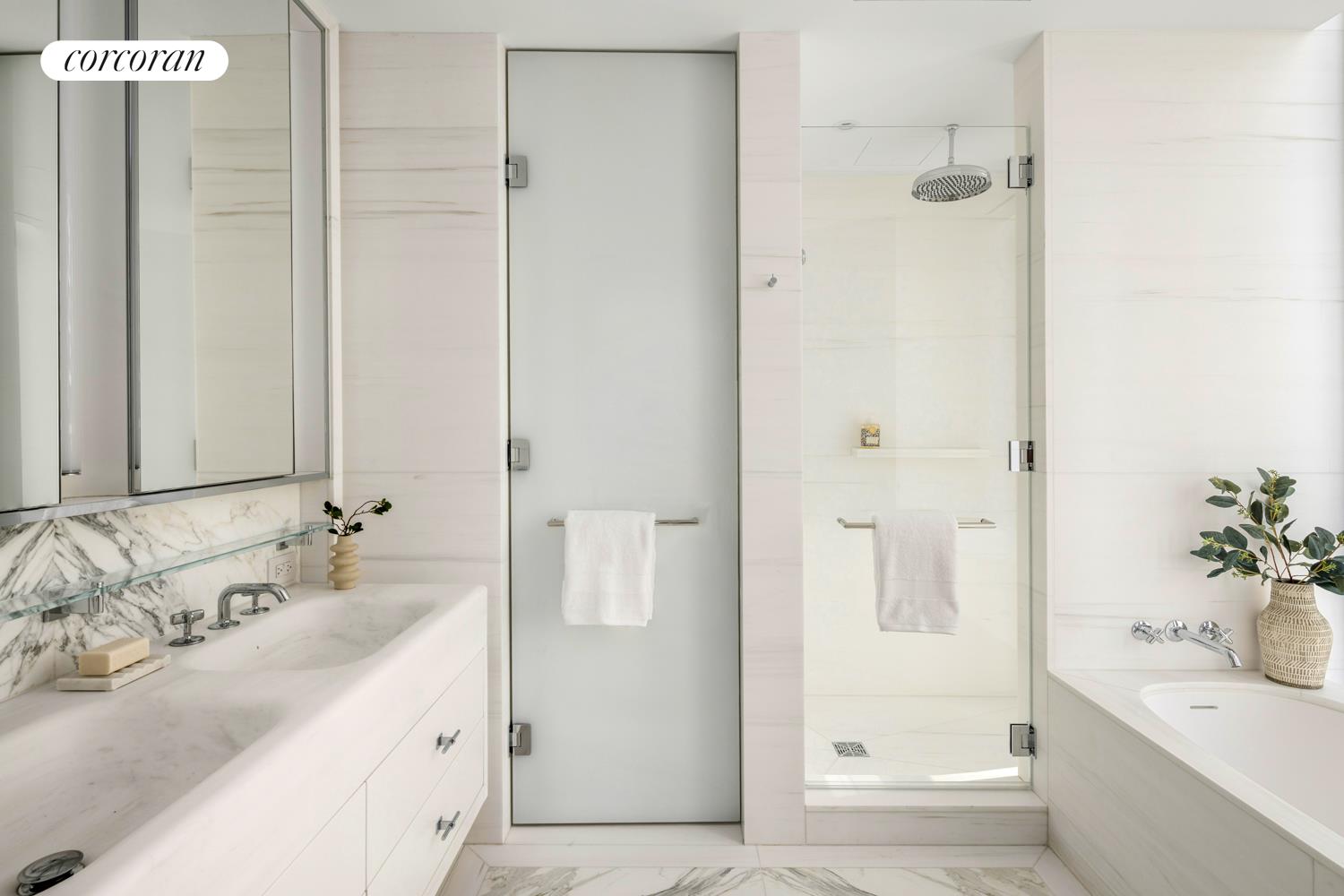 430 East 58th Street, Unit 19B Manhattan, NY 10022 - Photo 6 of 20 a bathroom with a tub sink and mirror