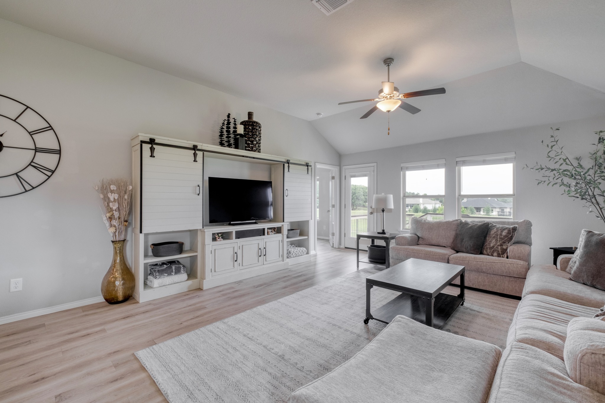 1000 Bright Star Cove Georgetown, TX 78628 - Photo 16 of 40 a living room with furniture and a flat screen tv