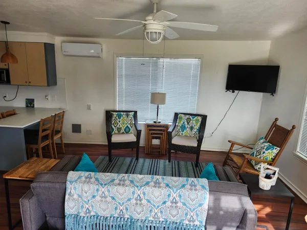 a living room with furniture and a flat screen tv