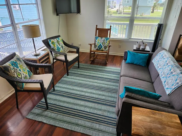 a living room with furniture and a window