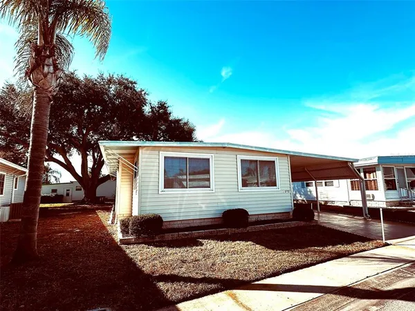 a front view of a house with yard