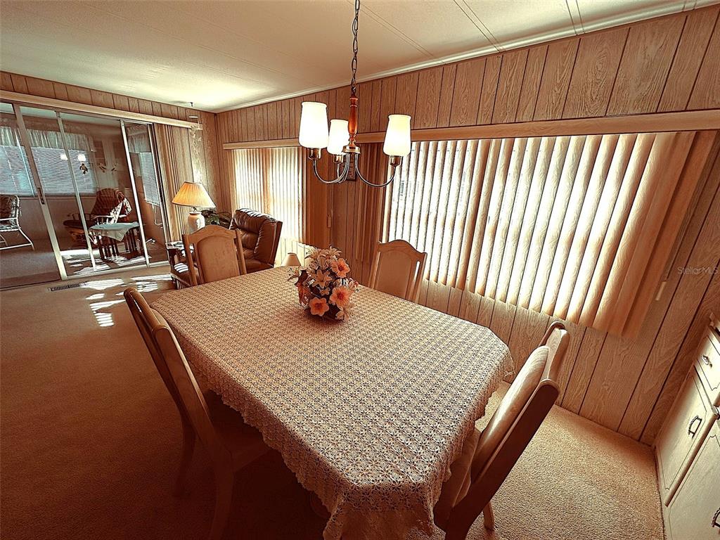 1100 South Belcher Road, Unit 508 Largo, FL 33771 - Photo 18 of 37 a view of a room with a table and chairs