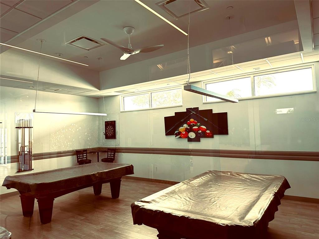 1100 South Belcher Road, Unit 508 Largo, FL 33771 - Photo 23 of 37 a living room with table and chairs