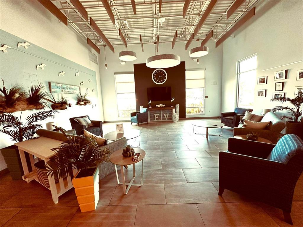 1100 South Belcher Road, Unit 508 Largo, FL 33771 - Photo 35 of 37 a living room with furniture and a chandelier