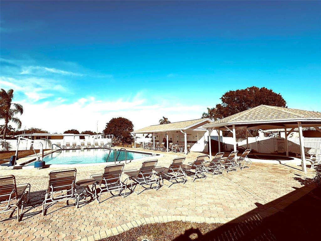 1100 South Belcher Road, Unit 508 Largo, FL 33771 - Photo 4 of 37 a view of a chairs and table in the patio