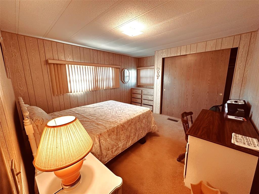 1100 South Belcher Road, Unit 508 Largo, FL 33771 - Photo 9 of 37 a bedroom with a bed and window