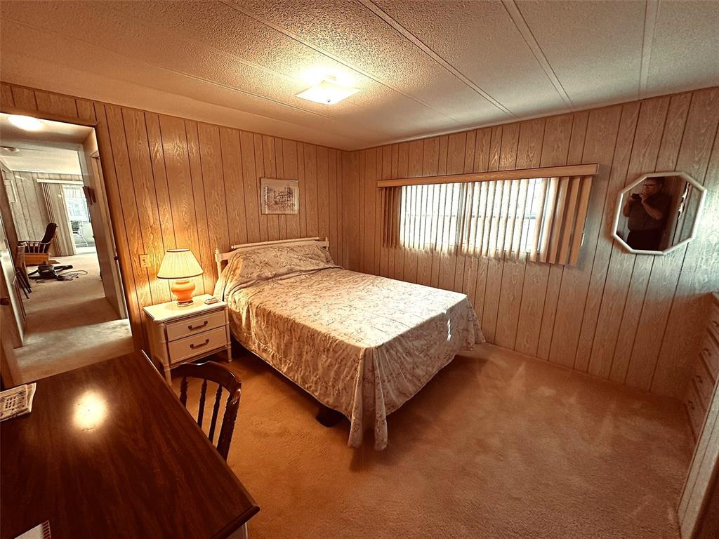 1100 South Belcher Road, Unit 508 Largo, FL 33771 - Photo 10 of 37 a bedroom with a bed window and dresser