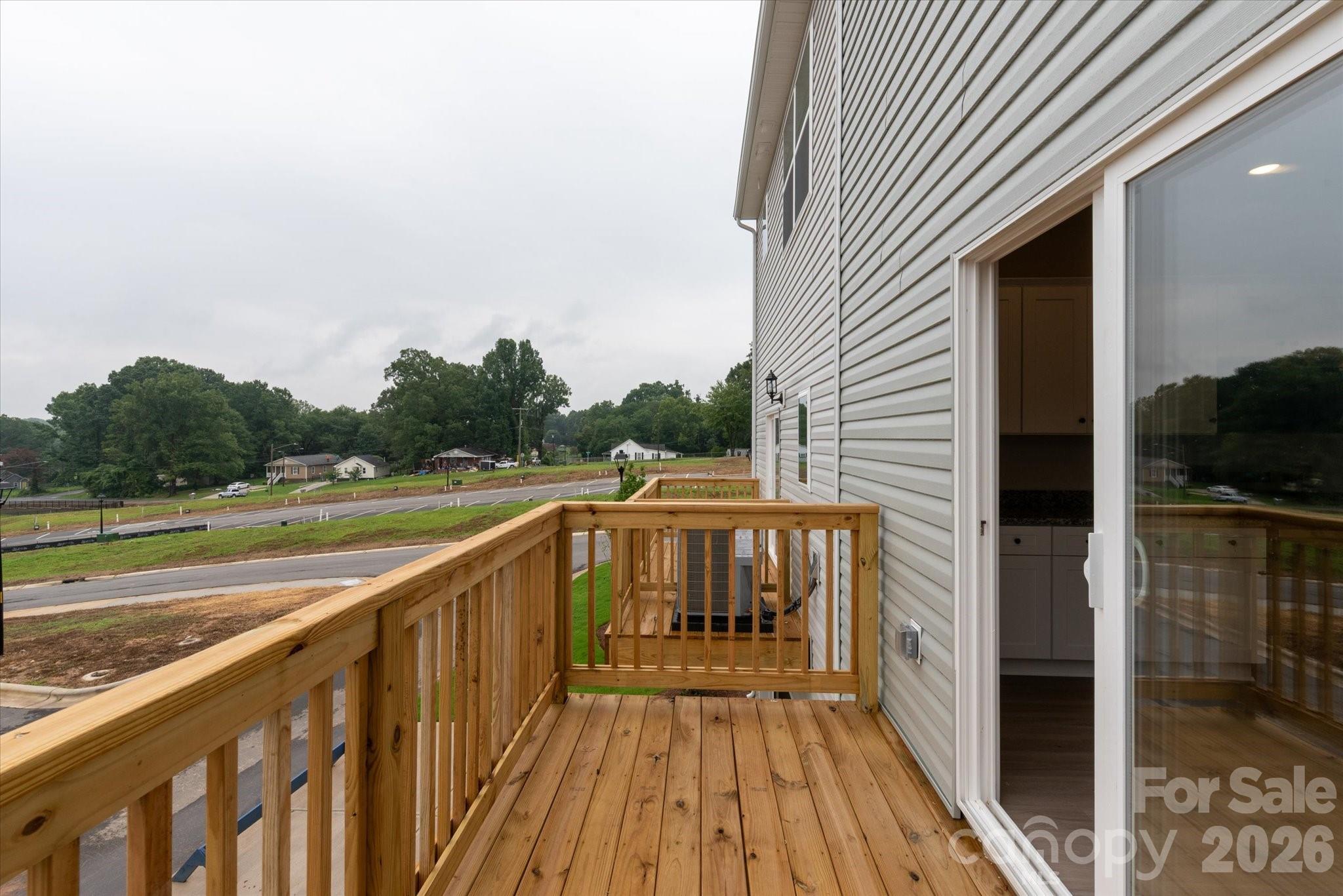 1850 Rhyne Elementary Drive Gastonia, NC 28052 - Photo 19 of 20 a view of balcony with wooden floor and fence