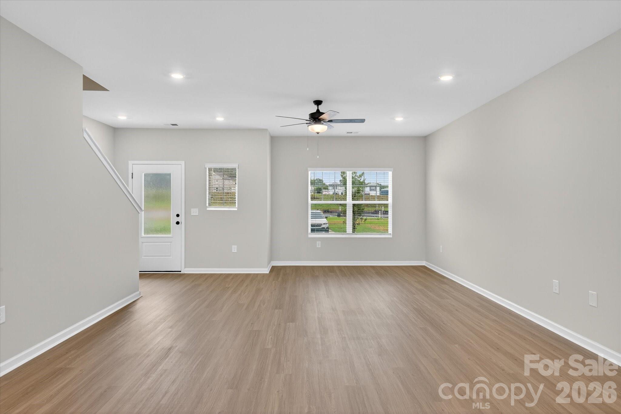 1850 Rhyne Elementary Drive Gastonia, NC 28052 - Photo 4 of 20 an empty room with wooden floor and windows