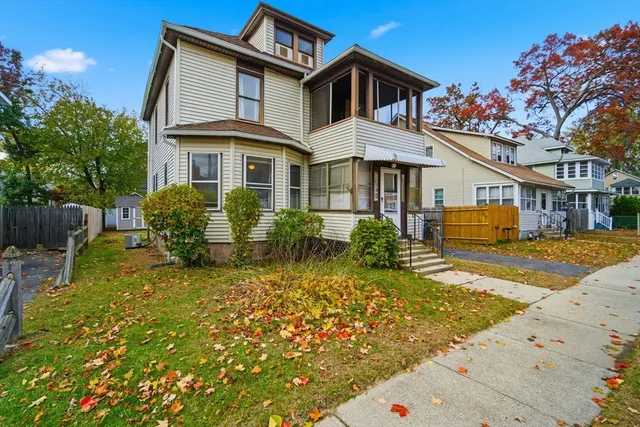 a front view of a house with garden