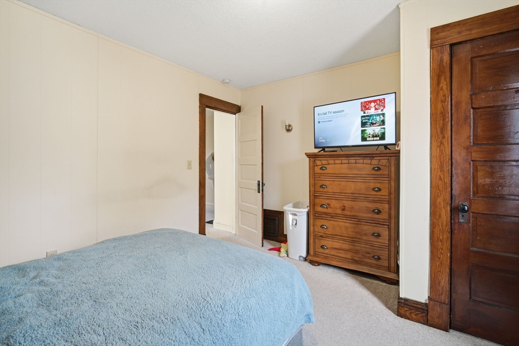 122 Hastings Street Springfield, MA 01104 - Photo 15 of 29 a view of bedroom with furniture and closet