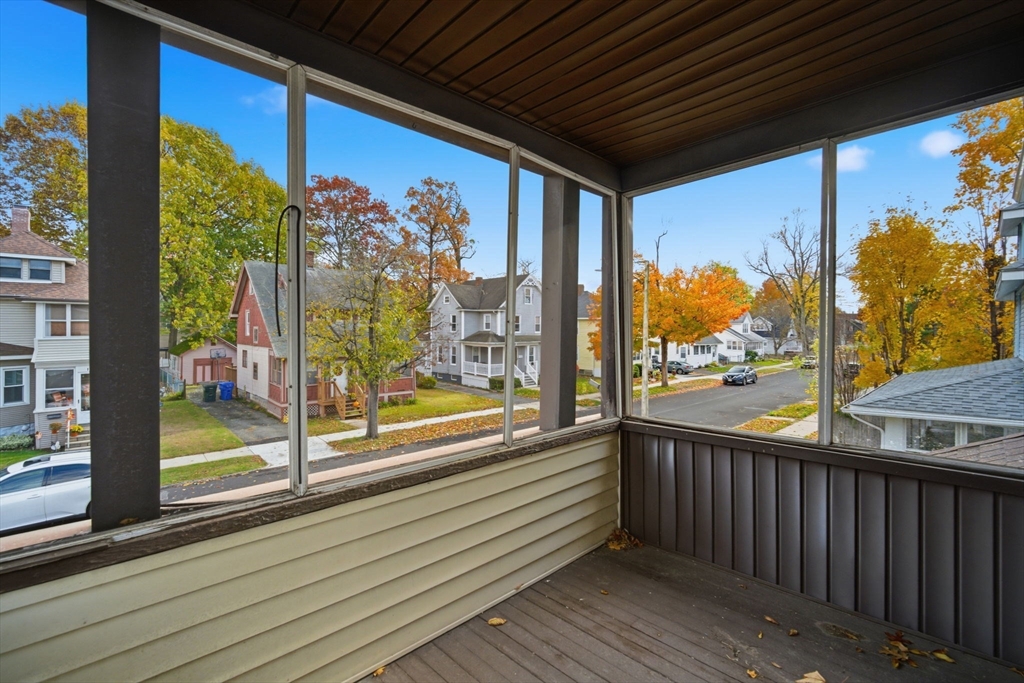 122 Hastings Street Springfield, MA 01104 - Photo 18 of 29 a view of a porch with a table and chairs