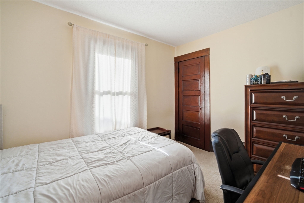 122 Hastings Street Springfield, MA 01104 - Photo 20 of 29 a bedroom with a bed and with furniture