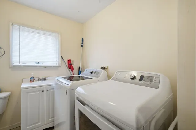 a utility room with dryer and washer
