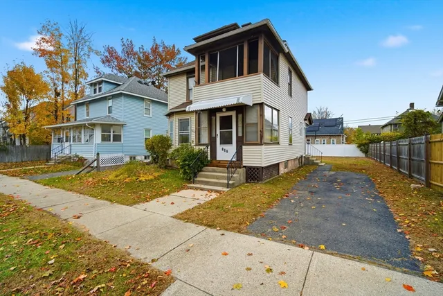 a front view of a house with a yard