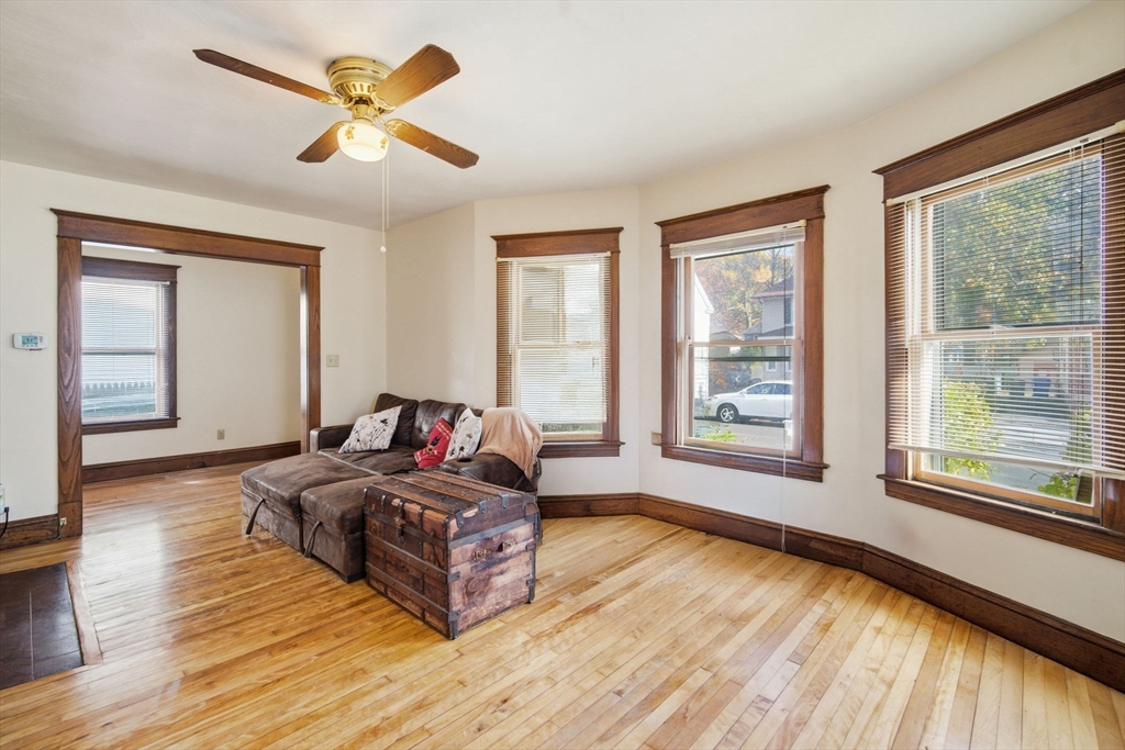 122 Hastings Street Springfield, MA 01104 - Photo 4 of 29 a living room with a bed furniture and a large window