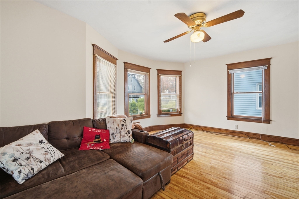 122 Hastings Street Springfield, MA 01104 - Photo 7 of 29 a living room with furniture and a large window
