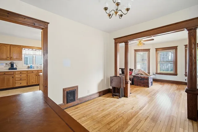 a view of a living room and a wooden floor