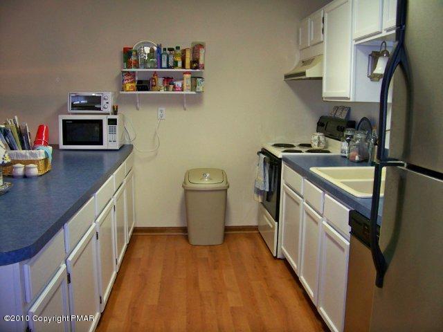 F2 Monomonock Road Cresco, PA 18326 - Photo 3 of 13 a kitchen with sink a stove and wooden floor