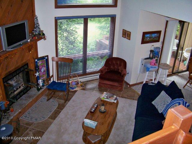 F2 Monomonock Road Cresco, PA 18326 - Photo 6 of 13 a living room with furniture a flat screen tv and a fireplace