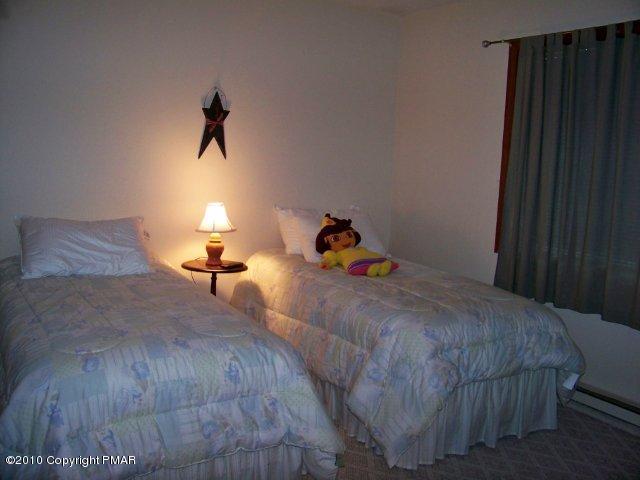 F2 Monomonock Road Cresco, PA 18326 - Photo 7 of 13 a bedroom with a bed and window