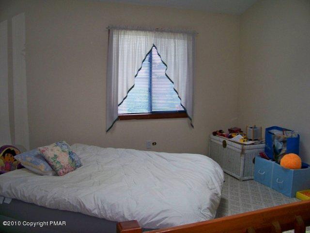 F2 Monomonock Road Cresco, PA 18326 - Photo 9 of 13 a bedroom with bed and window