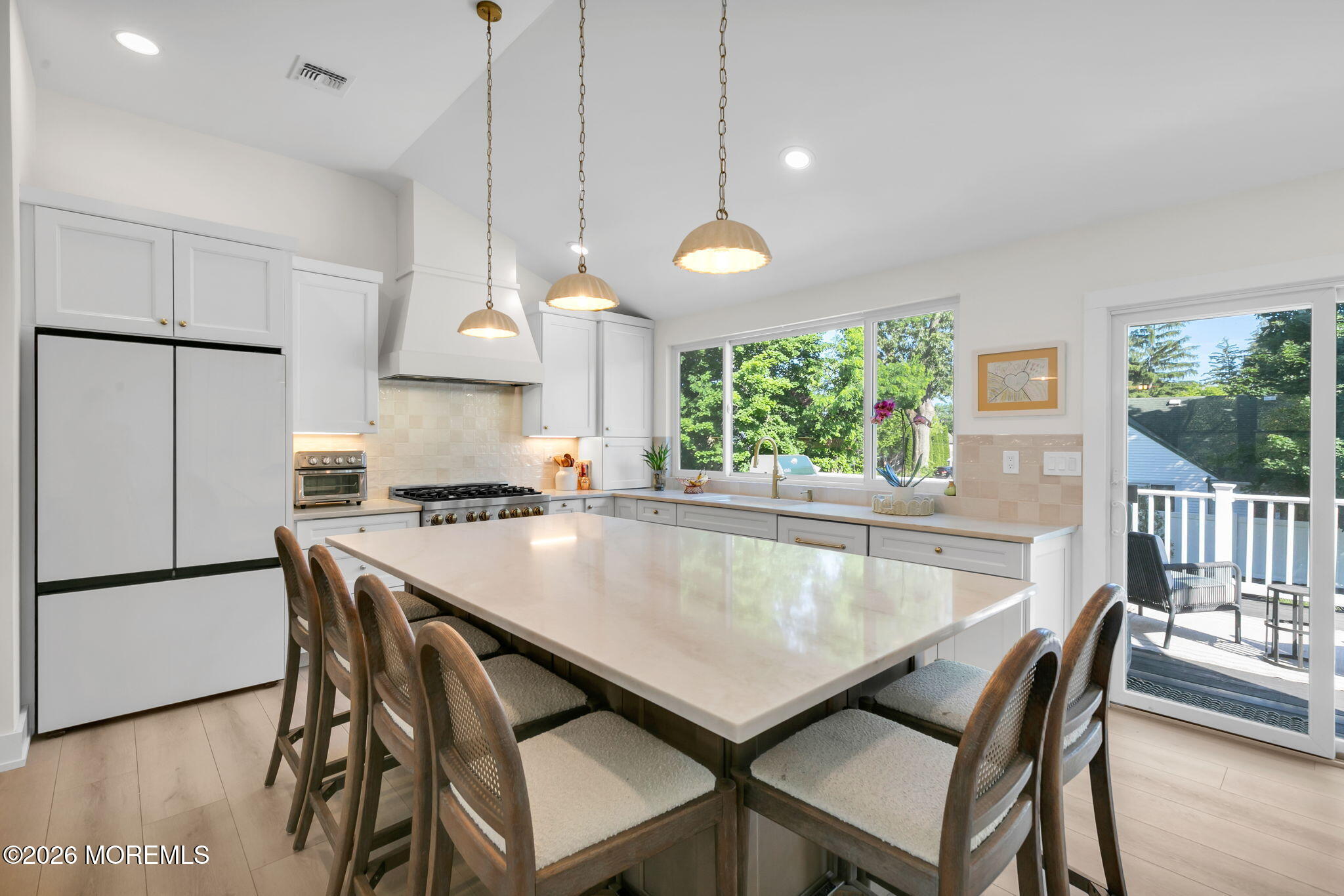 53 Field Avenue Red Bank, NJ 07701 - Photo 10 of 39 a kitchen with a table chairs and a refrigerator