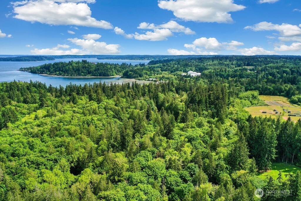 7817 East Hilldale Road Port Orchard, WA 98366 - Photo 23 of 24 a view of a lake with a building in background