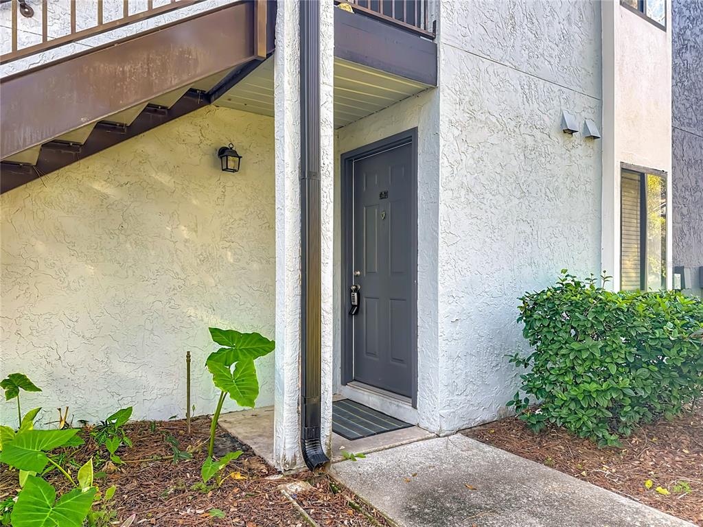 185 Waterfall Way, Unit 102 Altamonte Springs, FL 32714 - Photo 2 of 59 a door with a potted plant in front of door