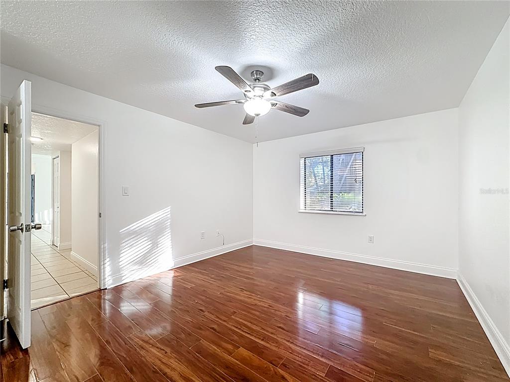 185 Waterfall Way, Unit 102 Altamonte Springs, FL 32714 - Photo 31 of 59 wooden floor in an empty room with a window