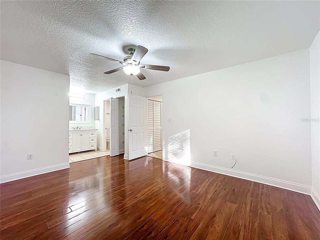 185 Waterfall Way, Unit 102 Altamonte Springs, FL 32714 - Photo 35 of 59 a view of an empty room with wooden floor