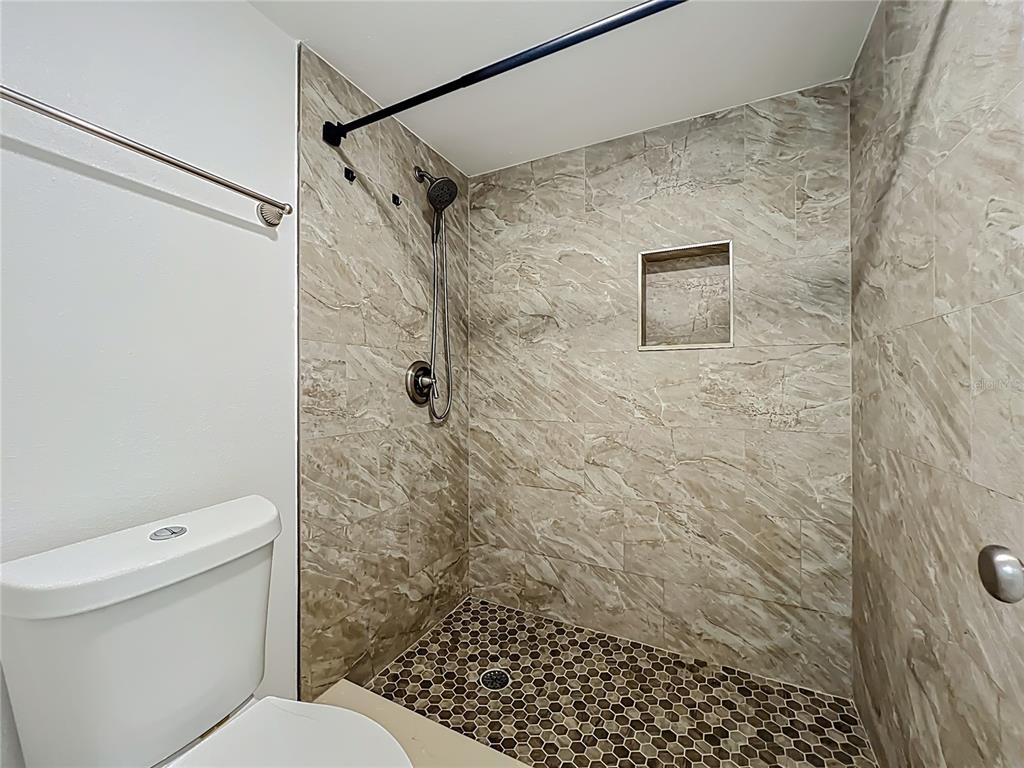185 Waterfall Way, Unit 102 Altamonte Springs, FL 32714 - Photo 42 of 59 a bathroom with a toilet and a shower