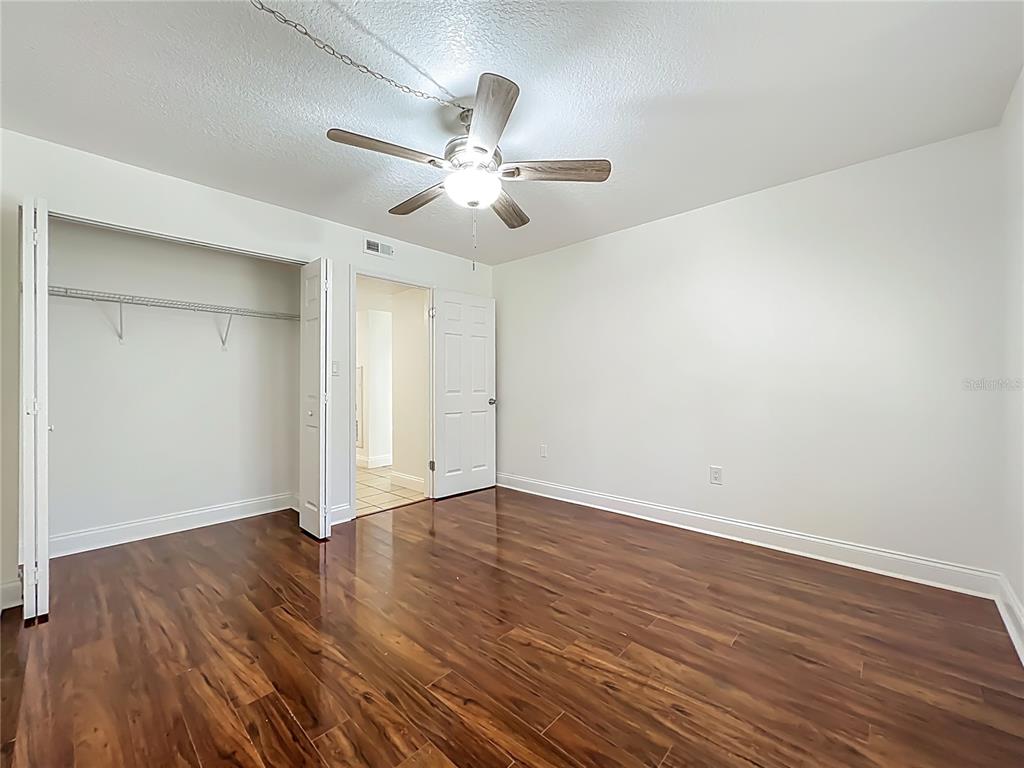 185 Waterfall Way, Unit 102 Altamonte Springs, FL 32714 - Photo 46 of 59 a view of an empty room with wooden floor
