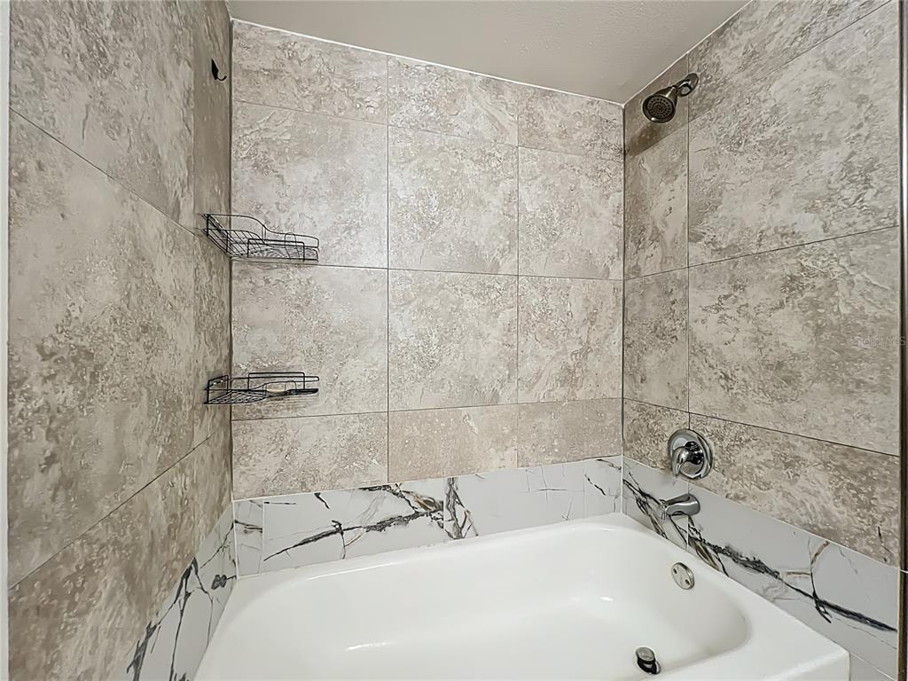 185 Waterfall Way, Unit 102 Altamonte Springs, FL 32714 - Photo 50 of 59 a bathroom with a sink and a shower