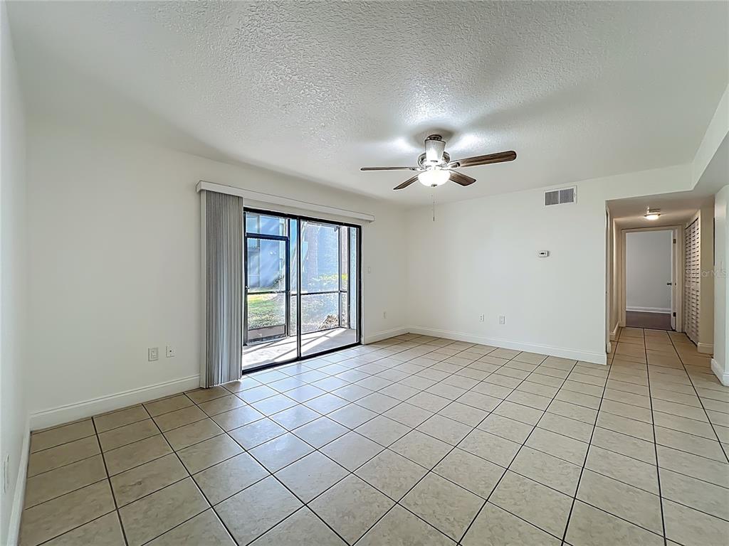 185 Waterfall Way, Unit 102 Altamonte Springs, FL 32714 - Photo 9 of 59 a view of an empty room with a window