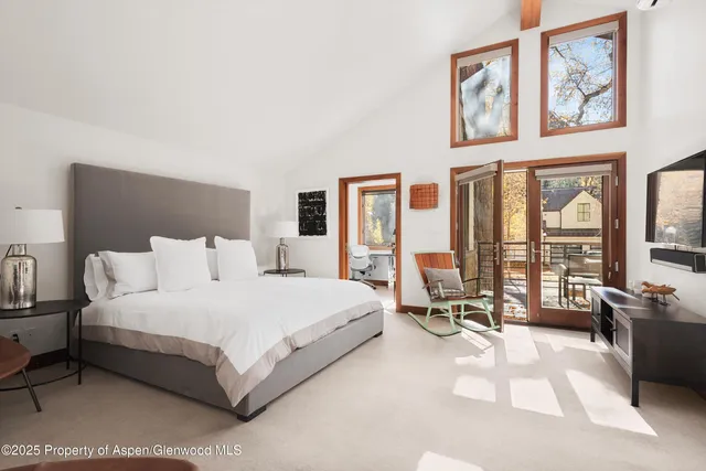 a bathroom with a tub a sink and a shower