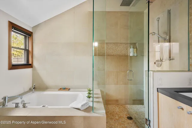 a bathroom with a granite countertop sink mirror and double