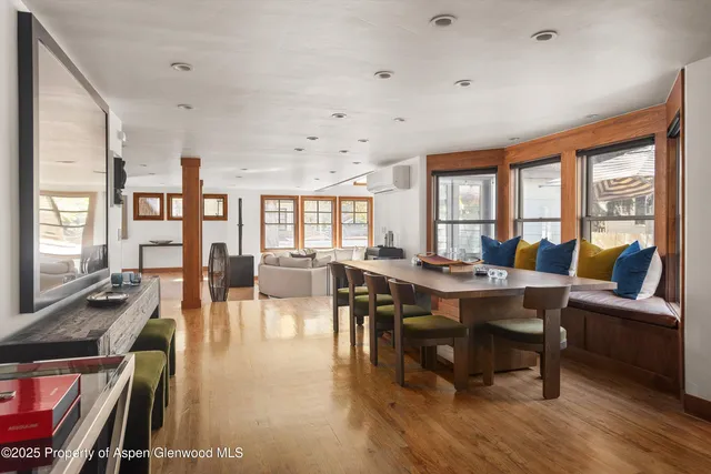 a view of a dining room with furniture window and outside view