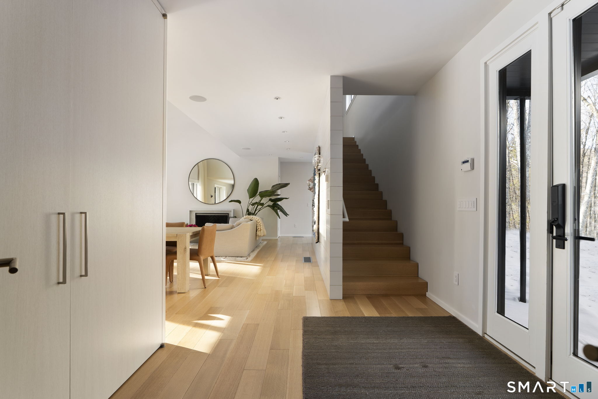 60 Selleck Hill Road Salisbury, CT 06068 - Photo 16 of 32 a view of a hallway with wooden floor fireplace and living room