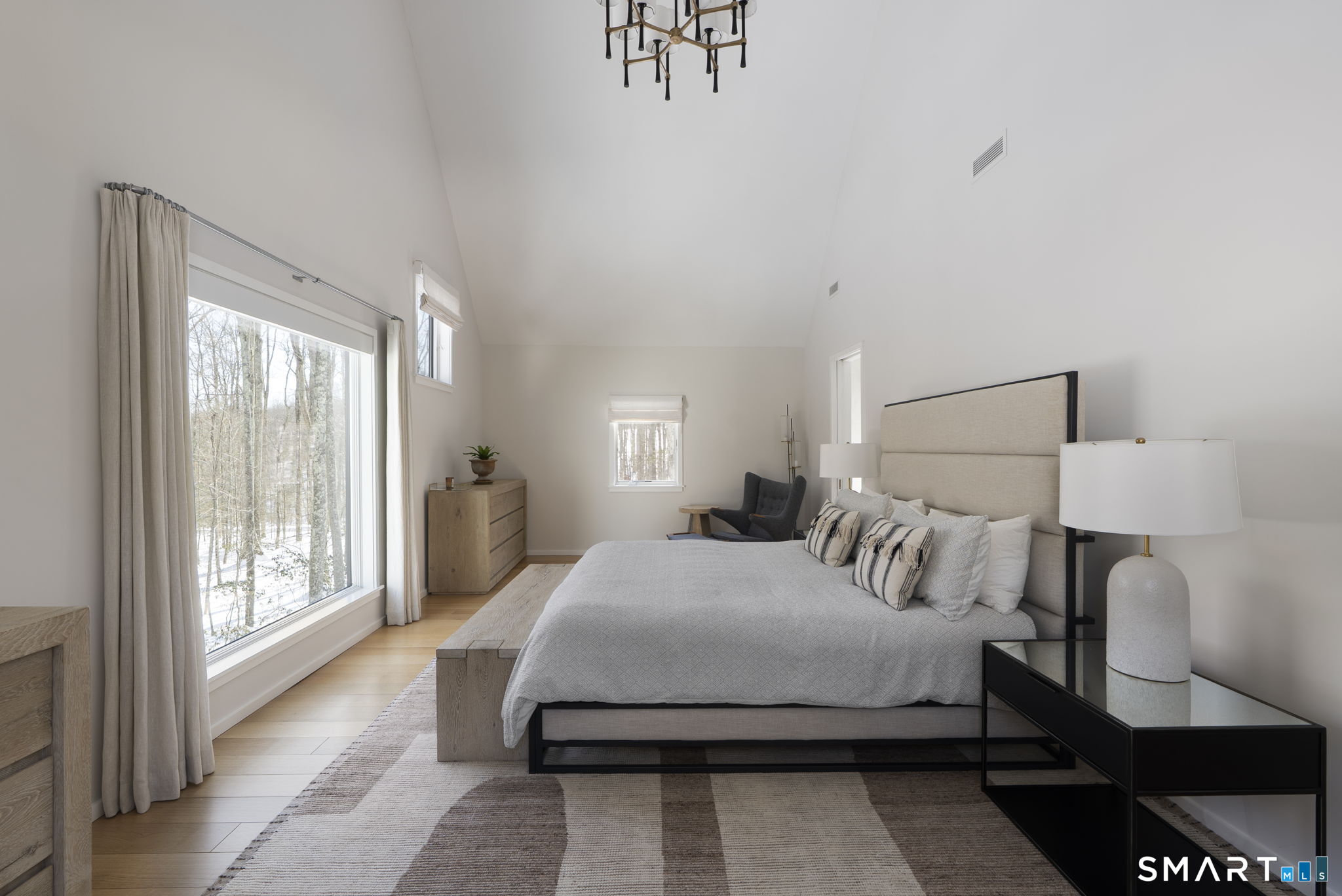 60 Selleck Hill Road Salisbury, CT 06068 - Photo 20 of 32 a bedroom with a large bed and a lamp next to a window