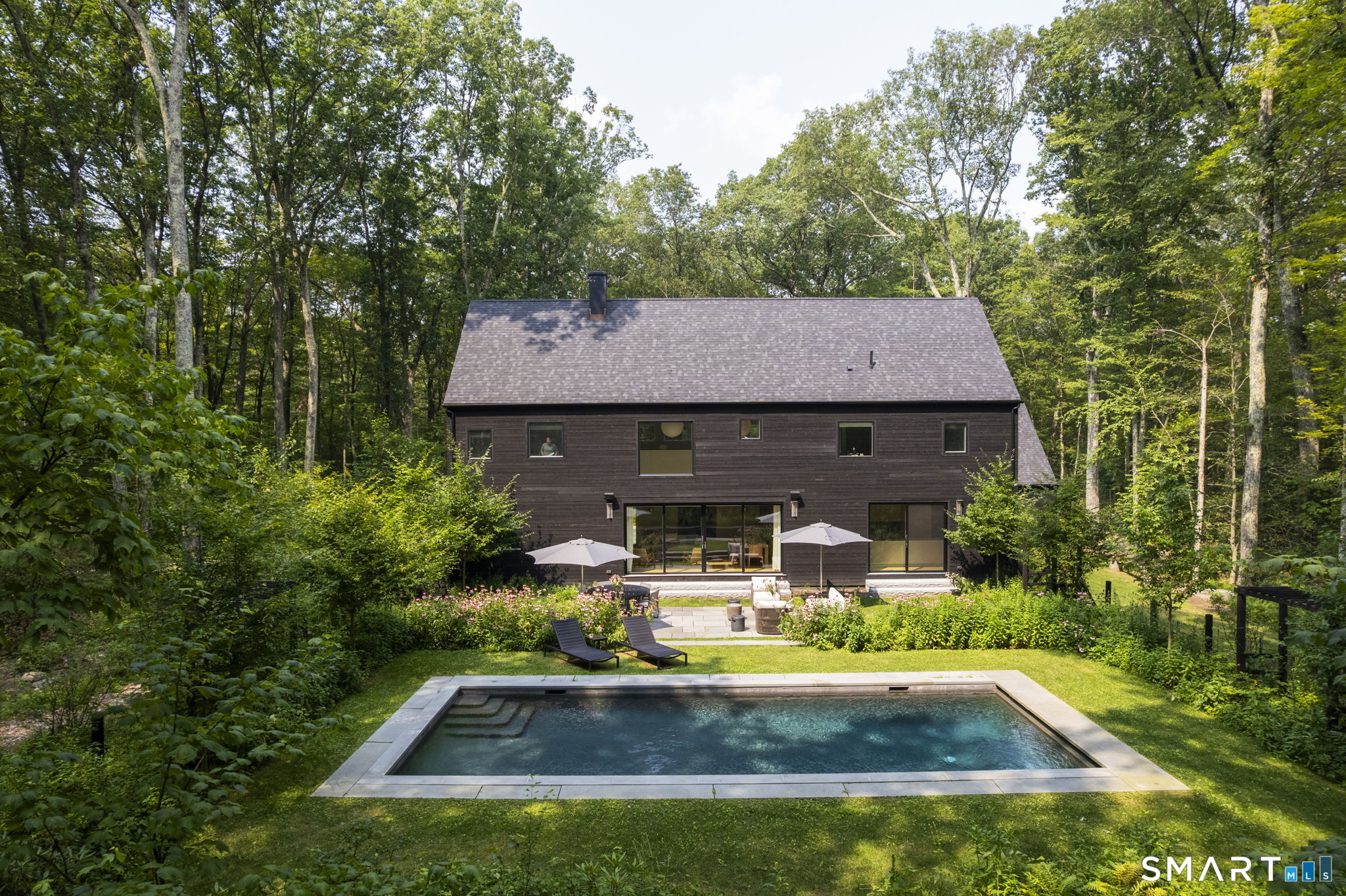 60 Selleck Hill Road Salisbury, CT 06068 - Photo 2 of 32 a view of house with garden space and sitting area