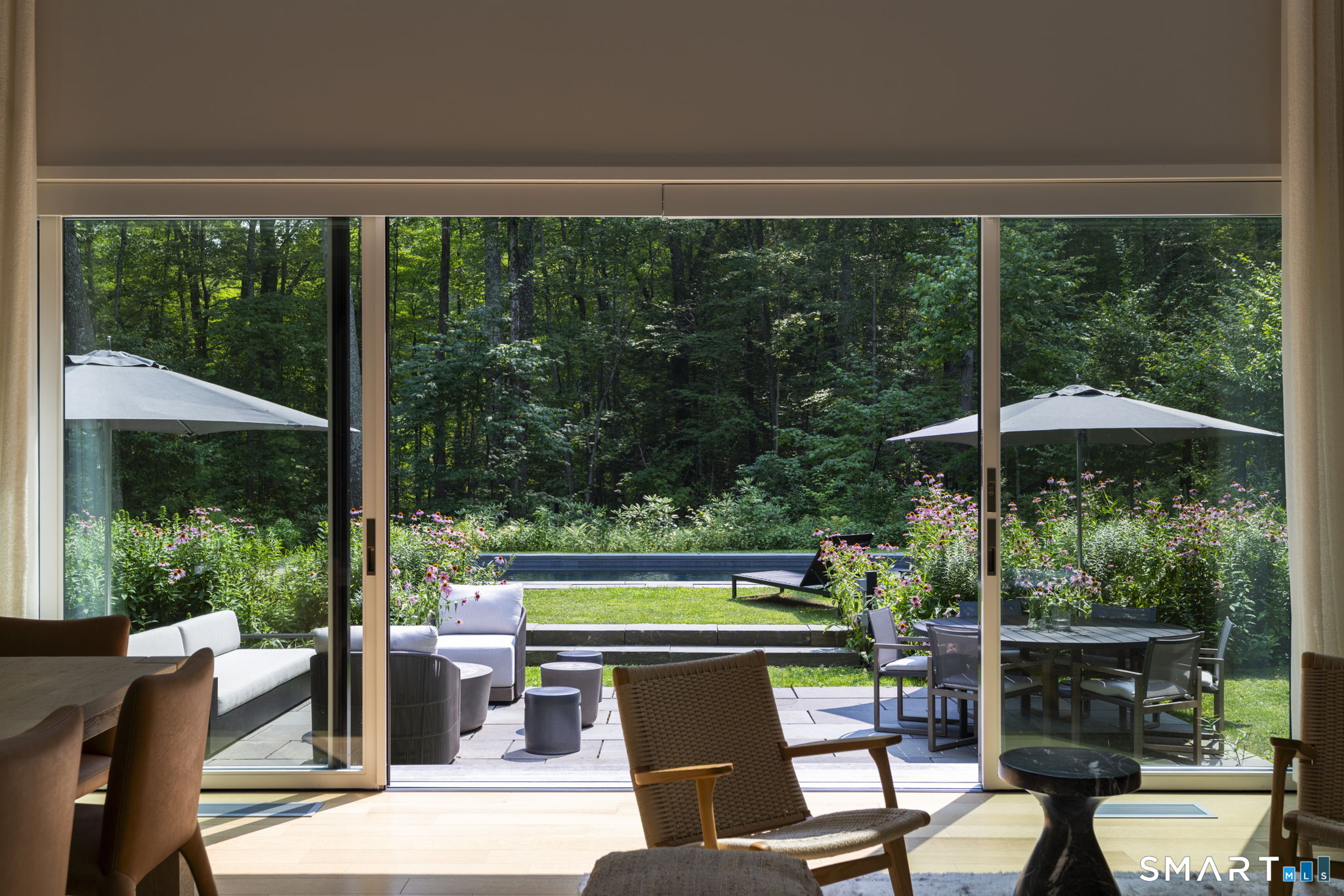 60 Selleck Hill Road Salisbury, CT 06068 - Photo 3 of 32 a view of a chair and table in the patio