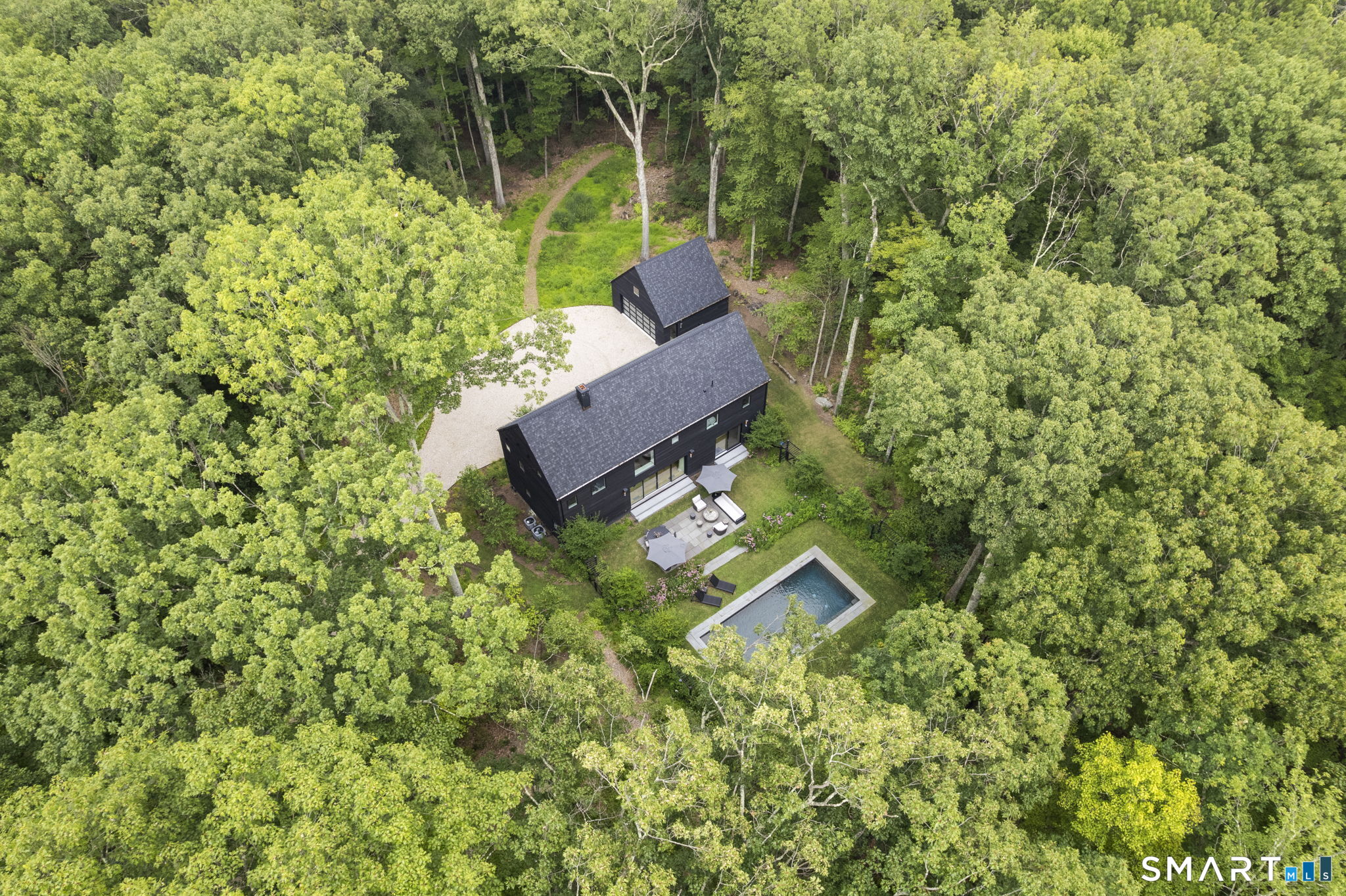 60 Selleck Hill Road Salisbury, CT 06068 - Photo 31 of 32 a view of a house with a backyard
