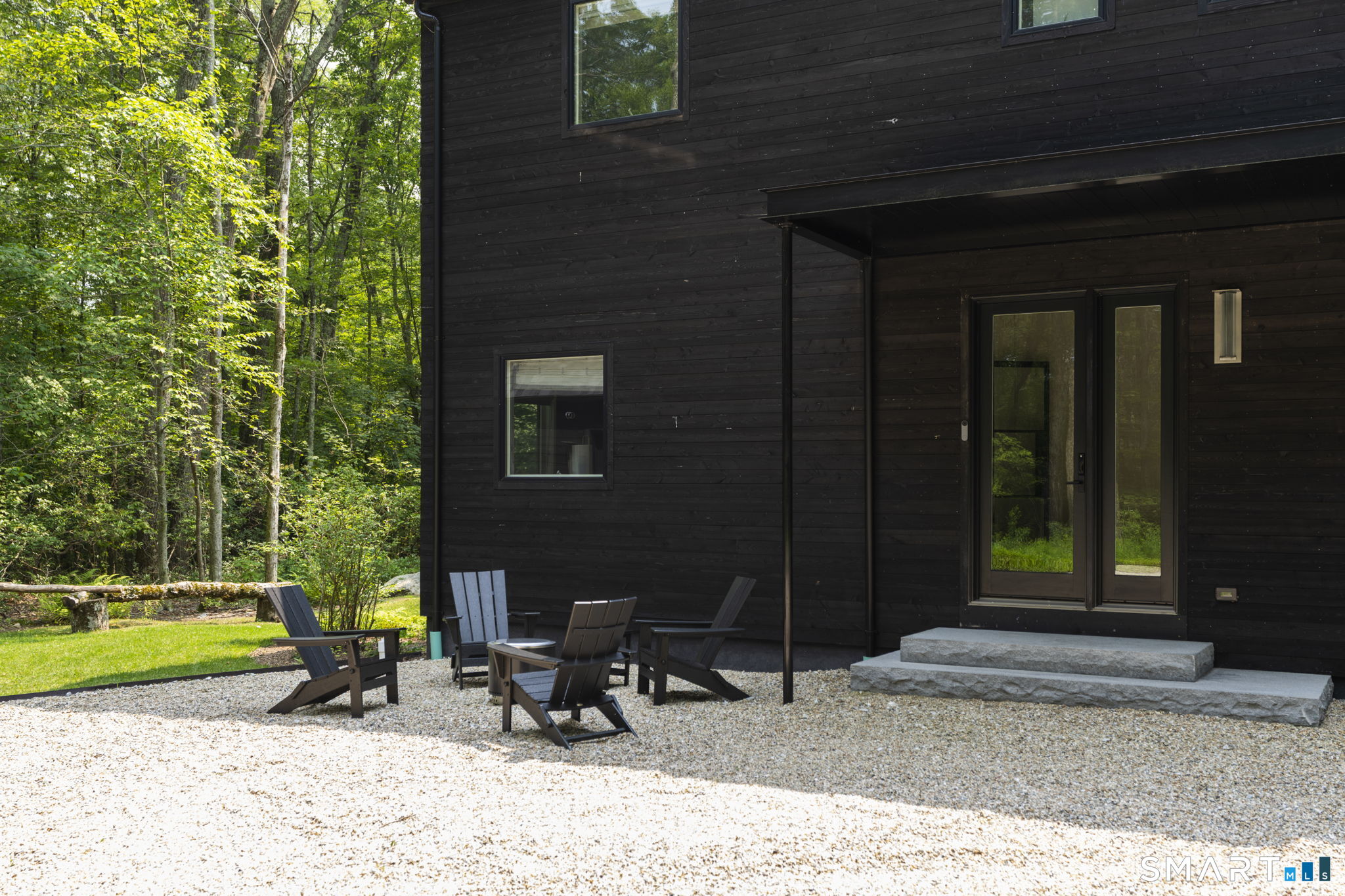 60 Selleck Hill Road Salisbury, CT 06068 - Photo 32 of 32 a bench is sitting in front of a house