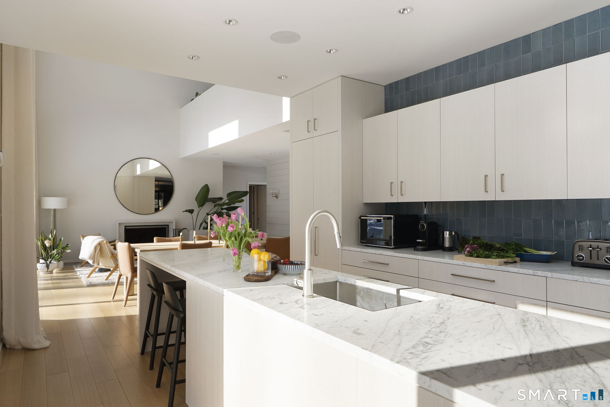 60 Selleck Hill Road Salisbury, CT 06068 - Photo 10 of 32 a kitchen with a sink a counter and chairs