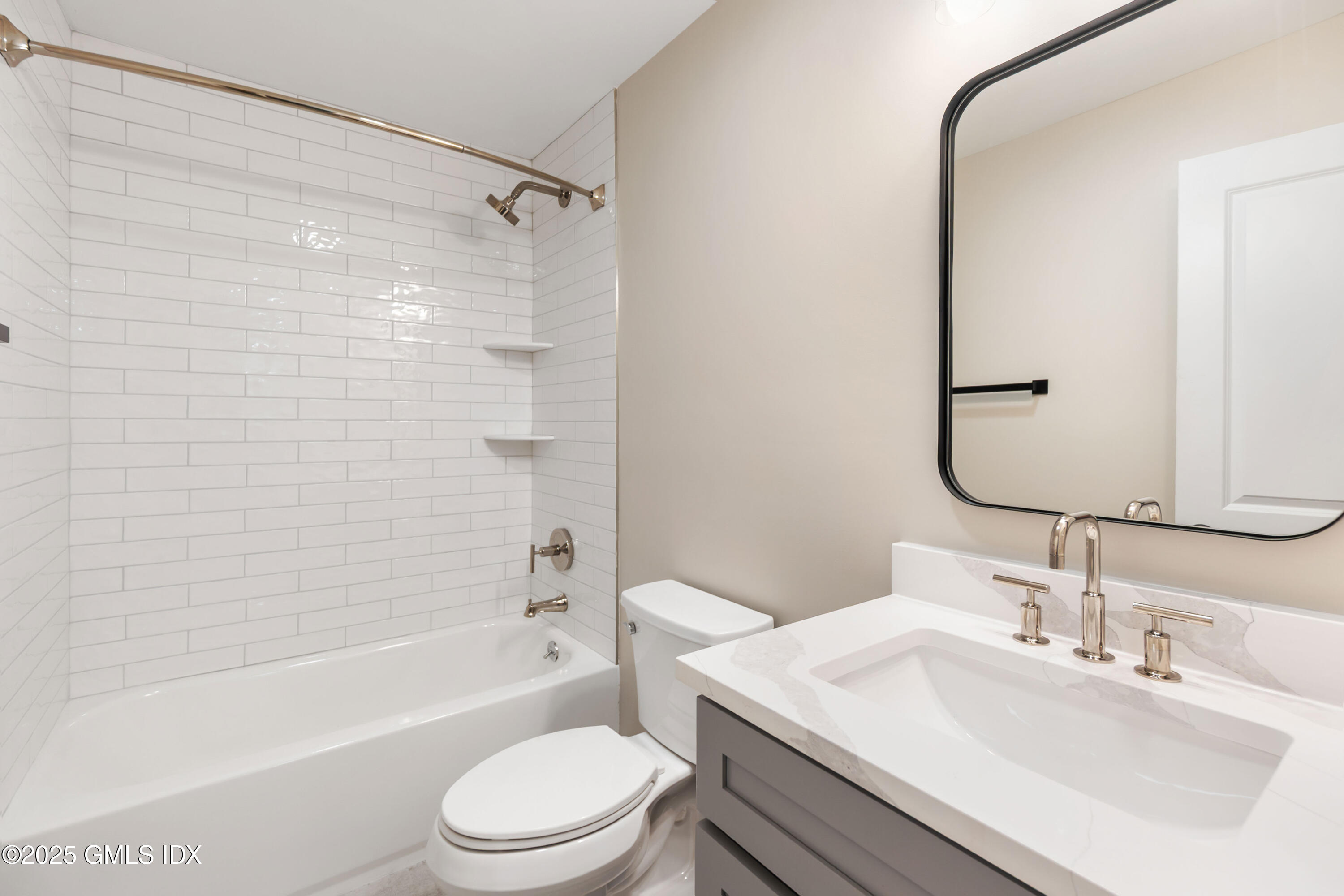 237 Weaver Street, Unit 8D Greenwich, CT 06831 - Photo 15 of 24 a bathroom with a sink toilet and shower