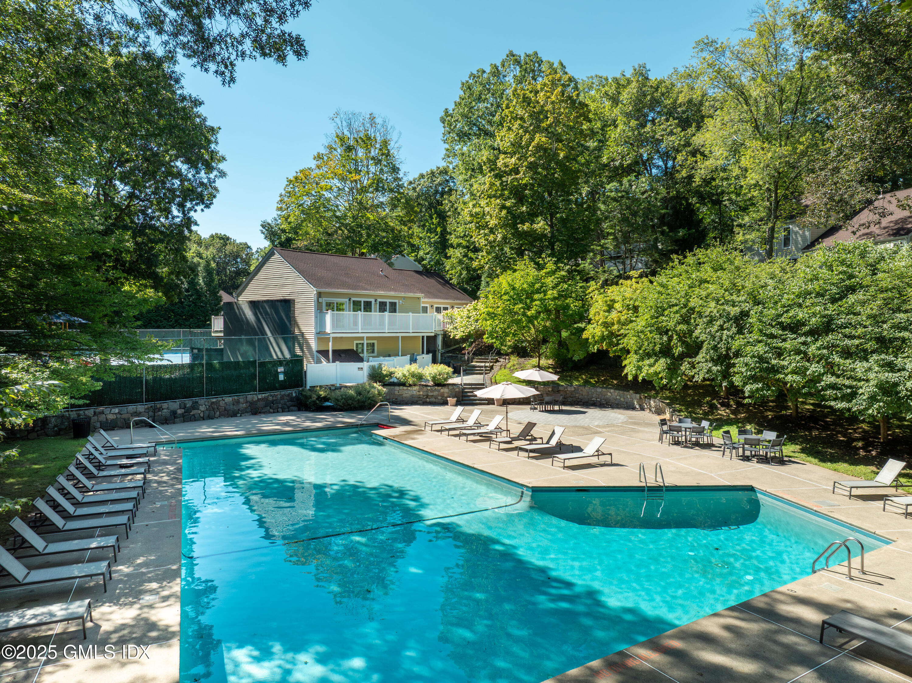 237 Weaver Street, Unit 8D Greenwich, CT 06831 - Photo 21 of 24 a view of a house with backyard porch and sitting area