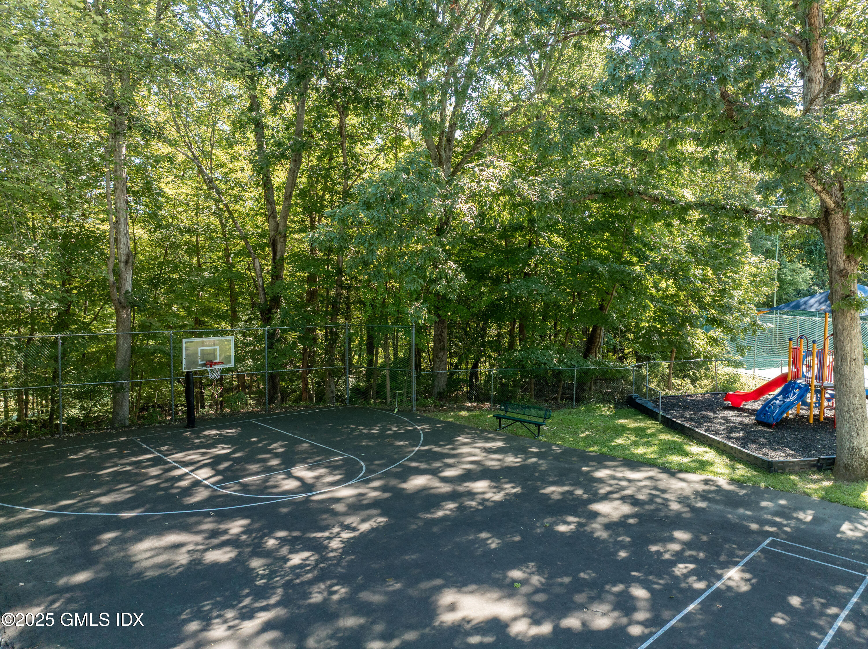 237 Weaver Street, Unit 8D Greenwich, CT 06831 - Photo 22 of 24 a view of a park with large trees