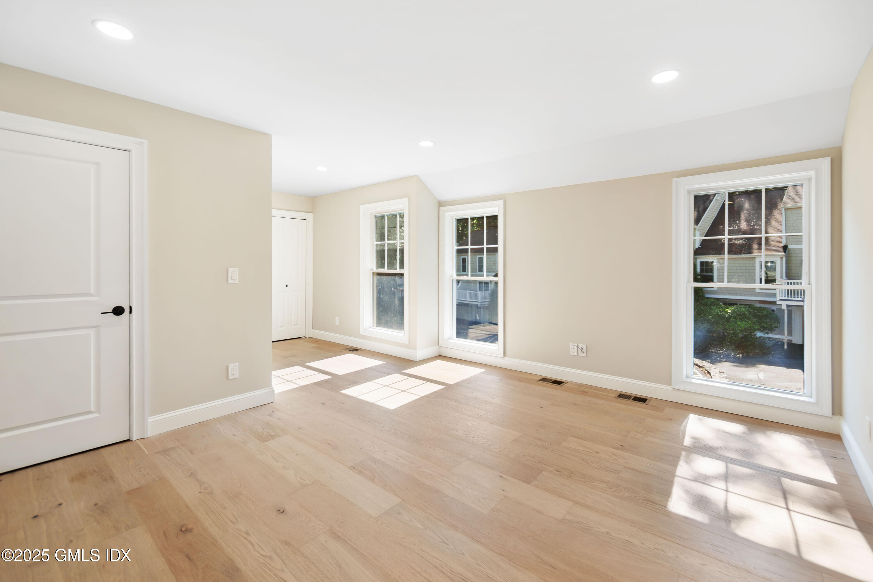 237 Weaver Street, Unit 8D Greenwich, CT 06831 - Photo 9 of 24 an empty room with windows