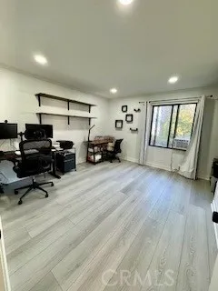 a view of a livingroom with hardwood and furniture